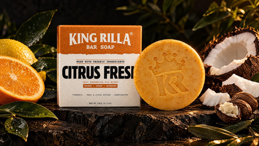 King Rilla Citrus Fresh soap with botanical ingredients in a dark editorial arrangement.