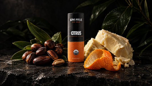 King Rilla Citrus lip balm with cosmetic ingredients on dark stone.