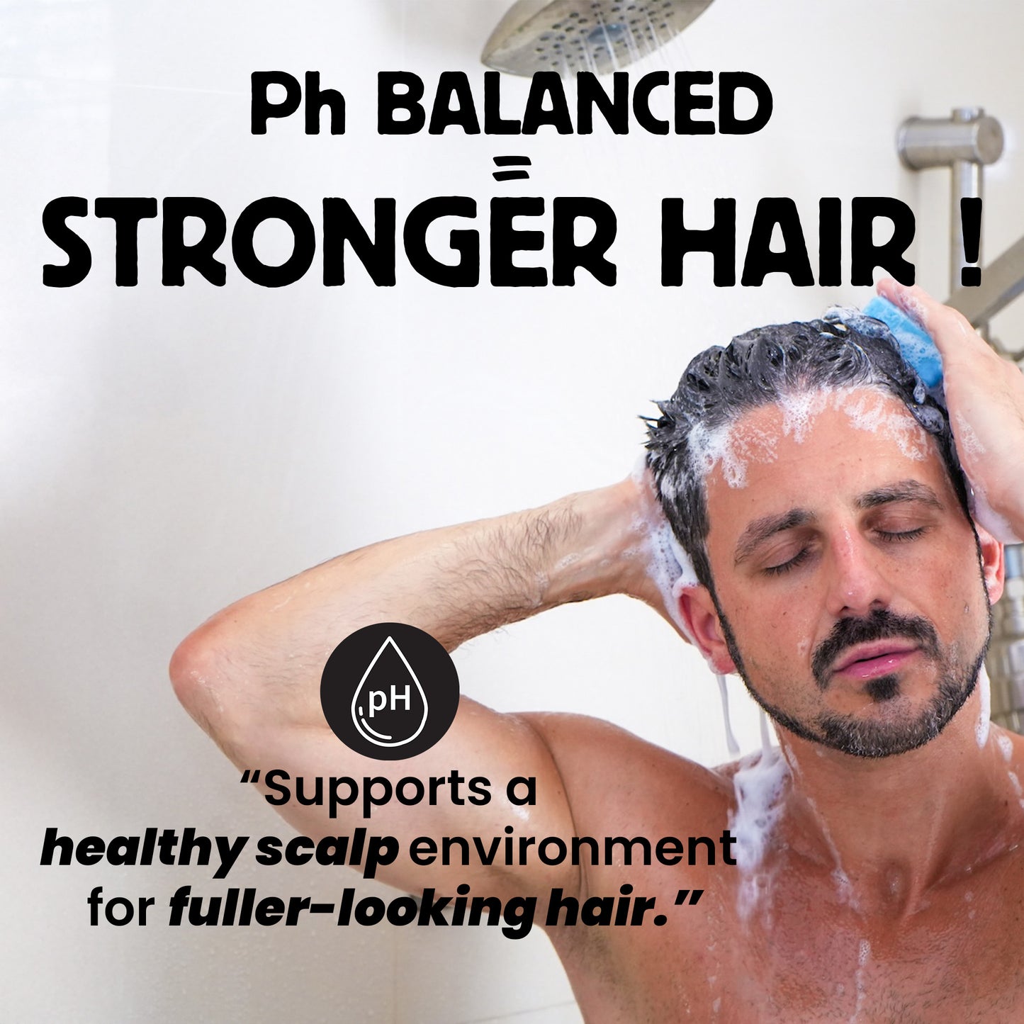 Man washing his hair with a shower head, promoting pH balanced hair care.