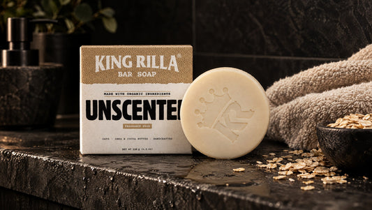 King Rilla Unscented soap with oats and a towel on a charcoal bathroom ledge.