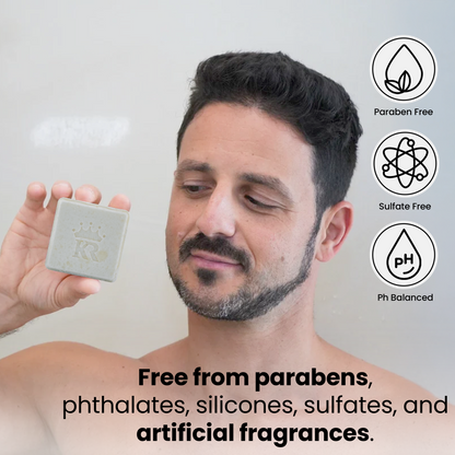 Man holding a bar of soap with product features highlighted on a light gray background