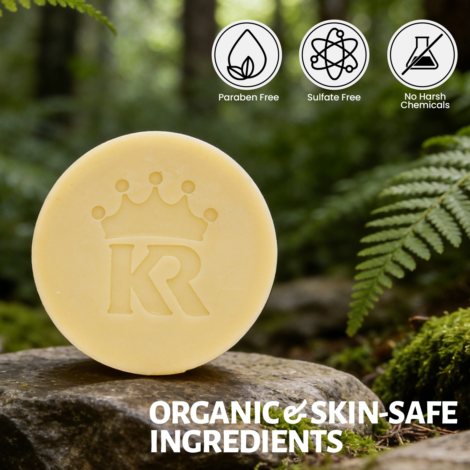 Bar of soap with a logo on a rock, surrounded by ferns, with 'Paraben Free', 'Sulfate Free', and 'No Harsh Chemicals' icons above it.