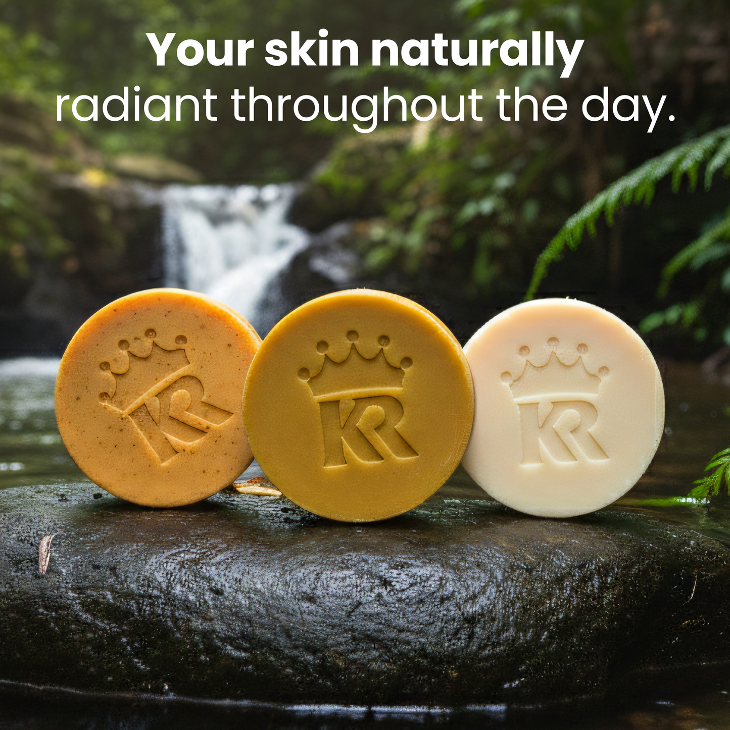 Three soap bars with a logo on a rock by a natural water setting