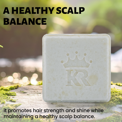 Bar of soap with a logo on a natural background, promoting healthy scalp balance.
