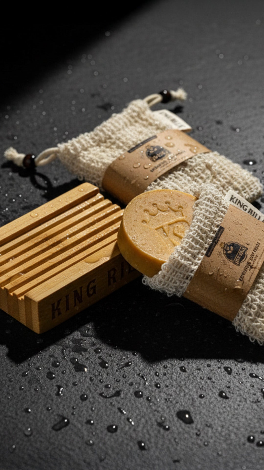 King Rilla soap and shower accessories on dark stone
