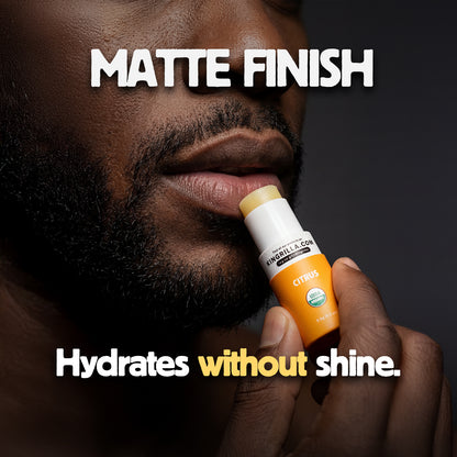 Person holding a lip balm with text about matte finish and hydration.