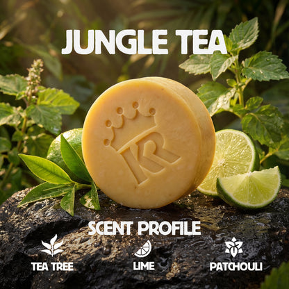 Bar of soap with 'Jungle Tea' branding on a natural background with leaves and lime slices.