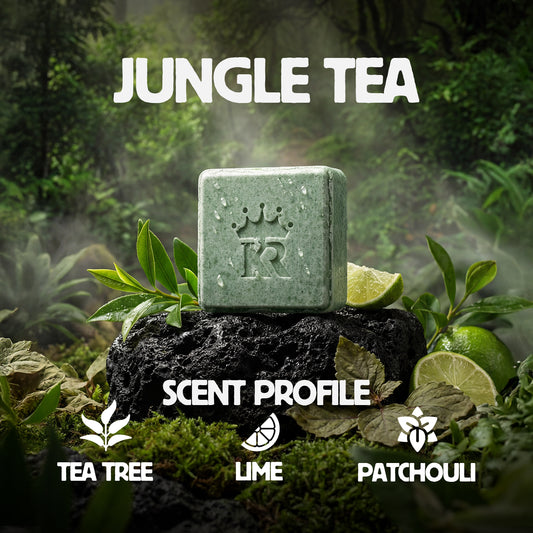 Green soap bar with 'Jungle Tea' branding on a natural background with leaves and lime slices.
