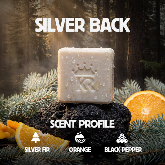 Bar of soap on a rock with oranges and tree branches, labeled 'Silver Back' and 'KR'.