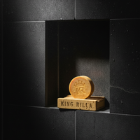 Soap bar with 'KING RILLA' branding on a dark stone background