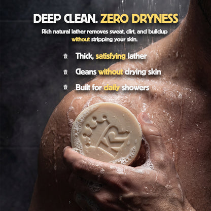 Hand holding a bar of soap with text about deep cleaning and zero dryness on a dark background.