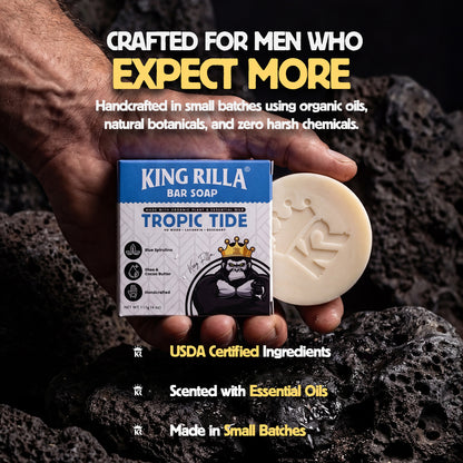 King Rilla Tropic Tide bar soap held by a hand with promotional text on a dark background