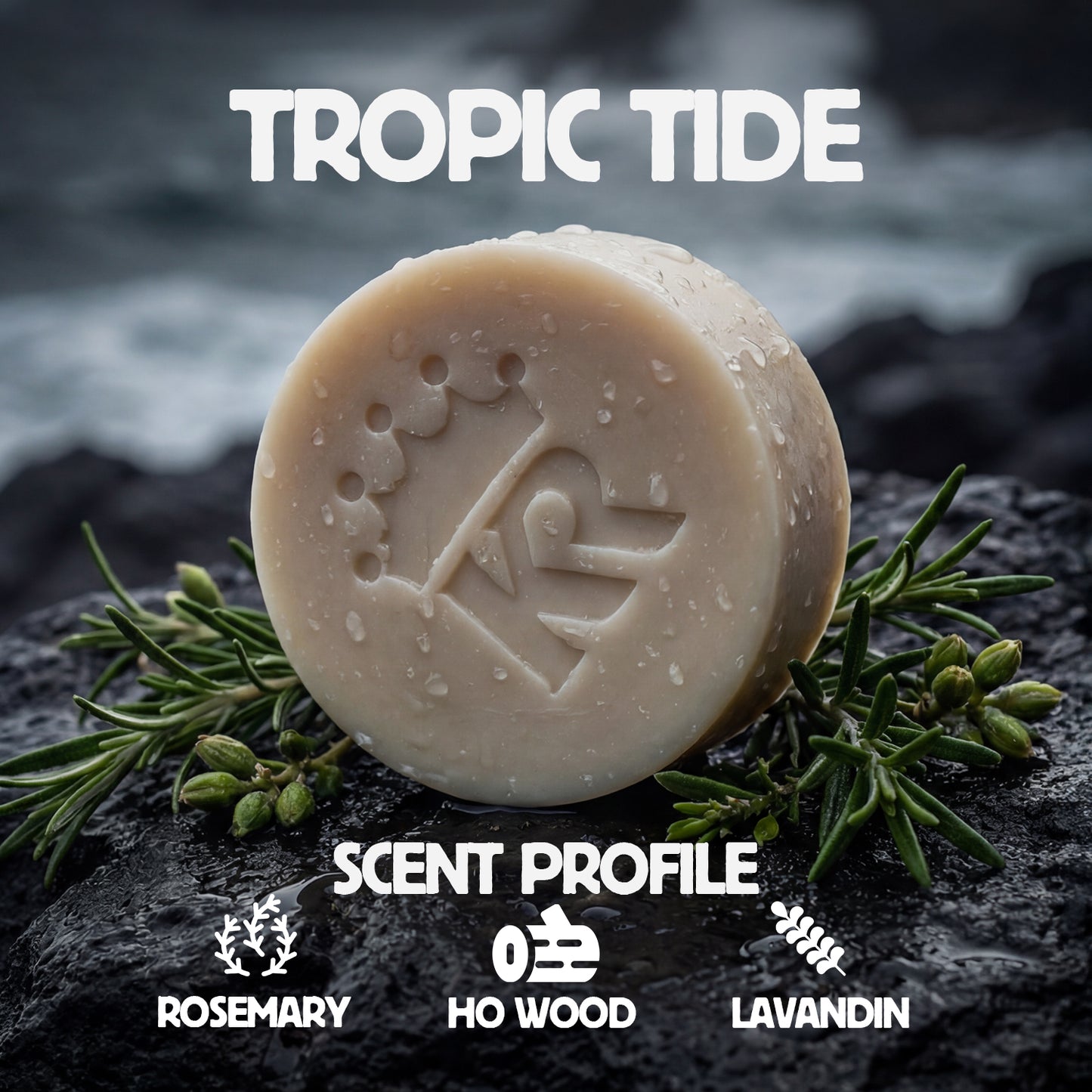 Bar of soap with 'Tropic Tide' branding on a dark surface with greenery, featuring the scent profile 'Rosemary, Ho Wood, Lavandin'.