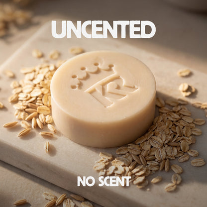 Bar of soap with oats on a stone surface, featuring the brand 'Uncented'.