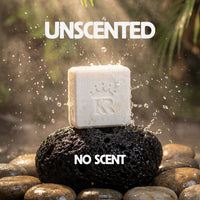 Bar of soap on a rock with water splashing around, labeled 'Unscented No Scent'.