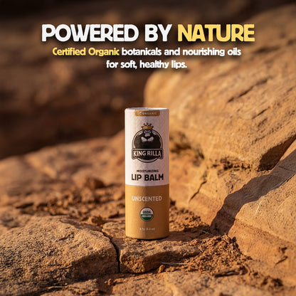 Lip balm container on a rocky surface with 'Powered by Nature' text
