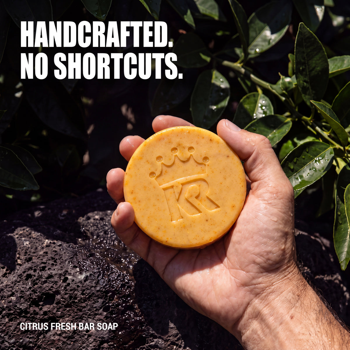 Hand holding a substantial handcrafted Citrus Fresh soap bar