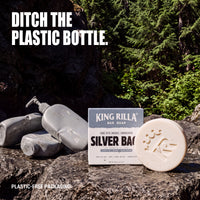Silver Back bar soap and plastic-free carton beside discarded liquid hand soap and body wash dispenser bottles