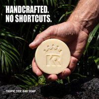 Handcrafted Tropic Tide soap held in a man's hand