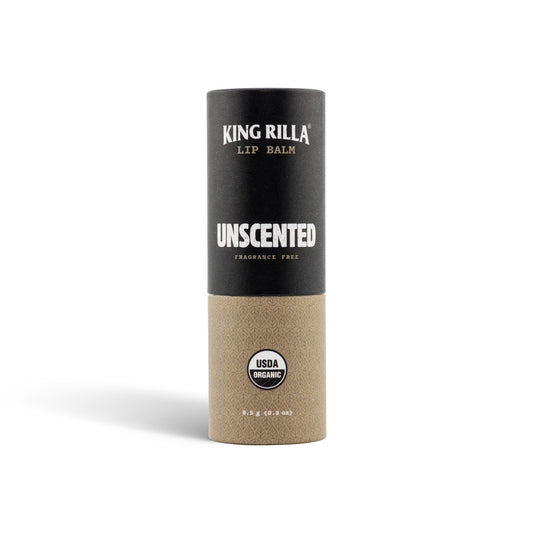 Unscented lip balm in black and tan packaging on white