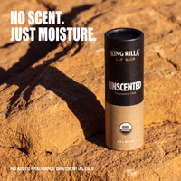 Fragrance-free Unscented lip balm on warm sandstone