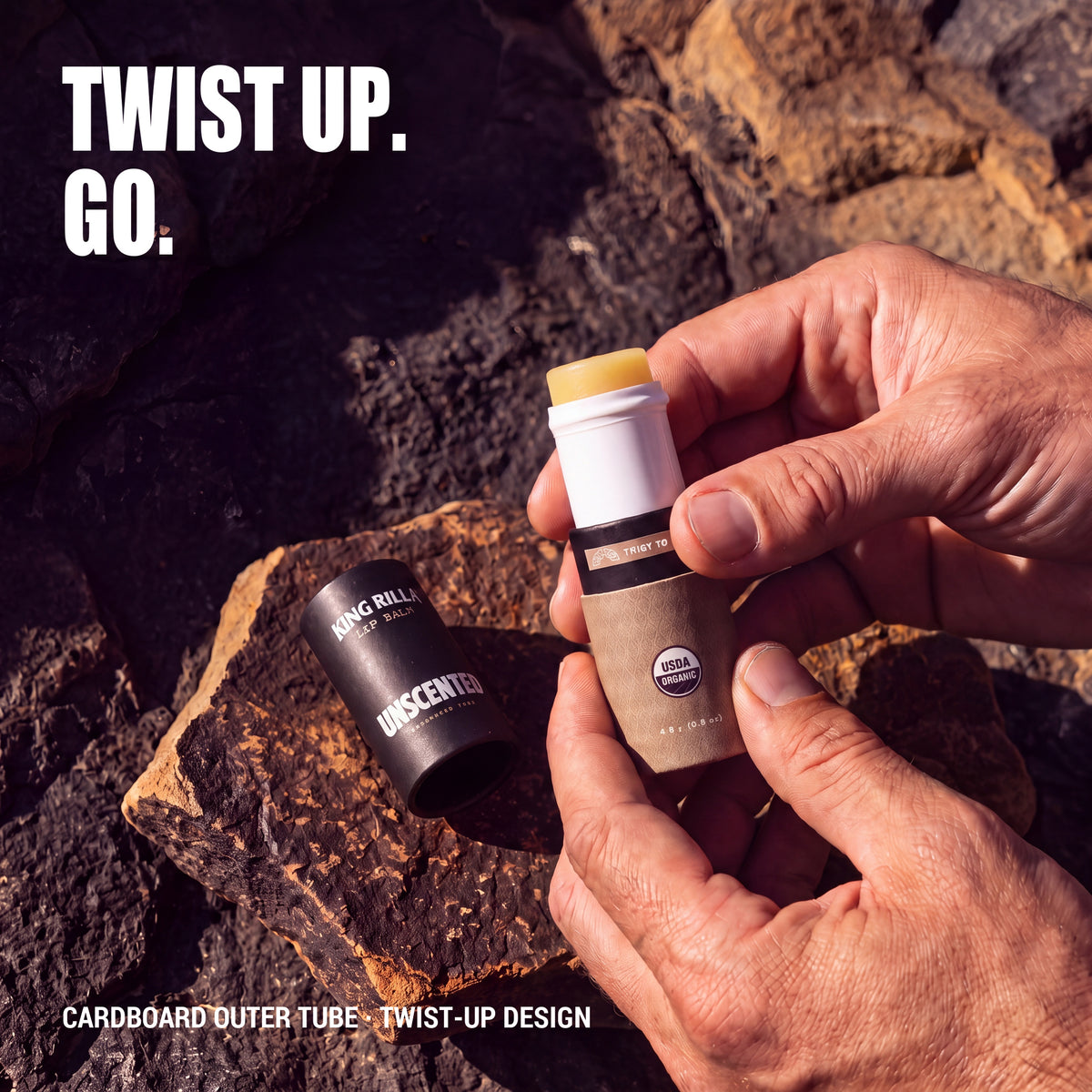 Hands twisting up Unscented lip balm with bright golden yellow balm